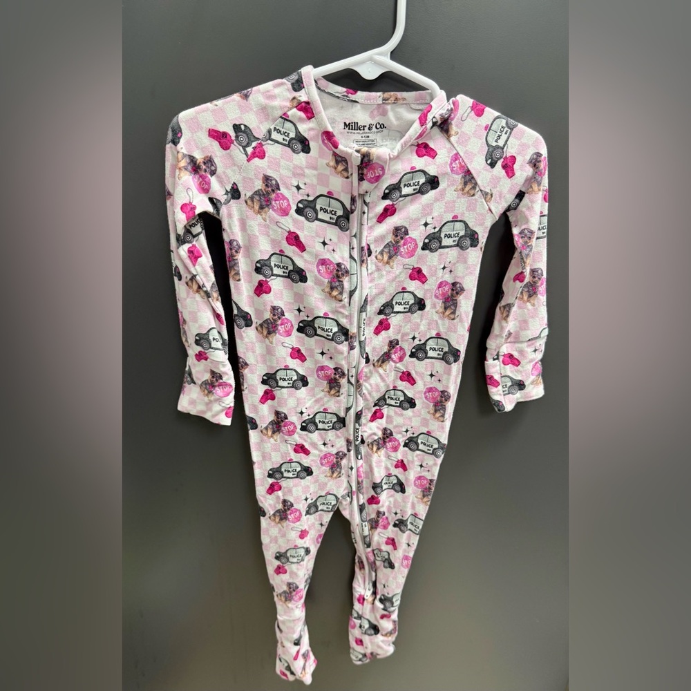 Miller & Co. Police Pup Zip Footie Pajamas
Size: 6–12 Months